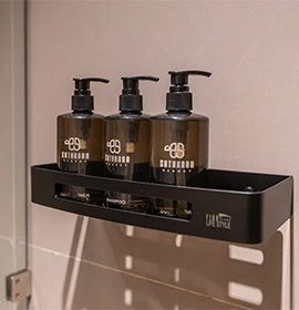  three shampoo bottles in the bathroom